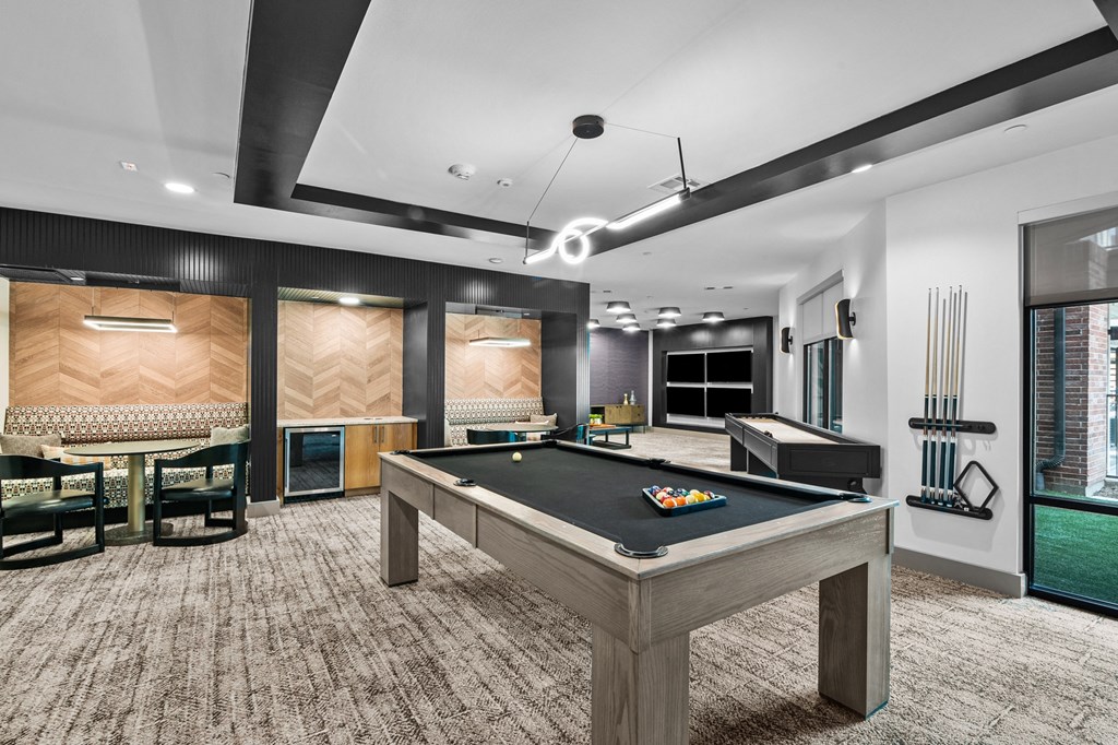 a games room with a pool table and foosball