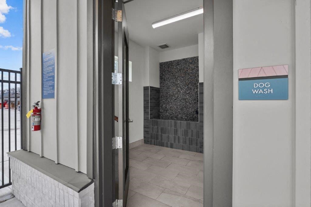 a dog wash room in a building with a door