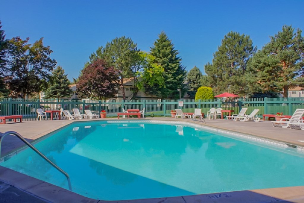 La Verde Apartments Pool Area with Lounge Chairs