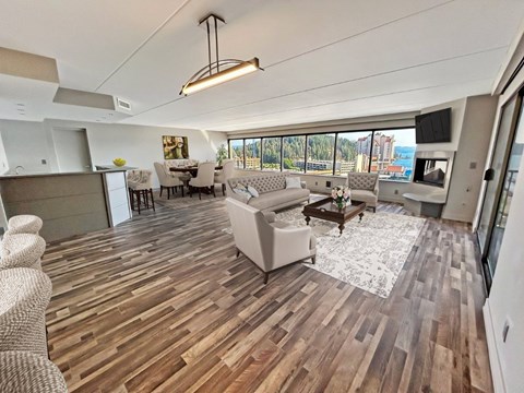 A spacious living room with a large couch and a coffee table.