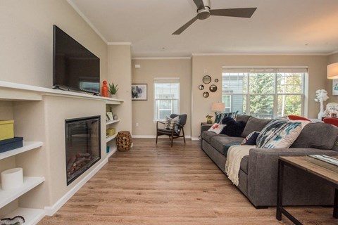 a living room with a fireplace and a couch