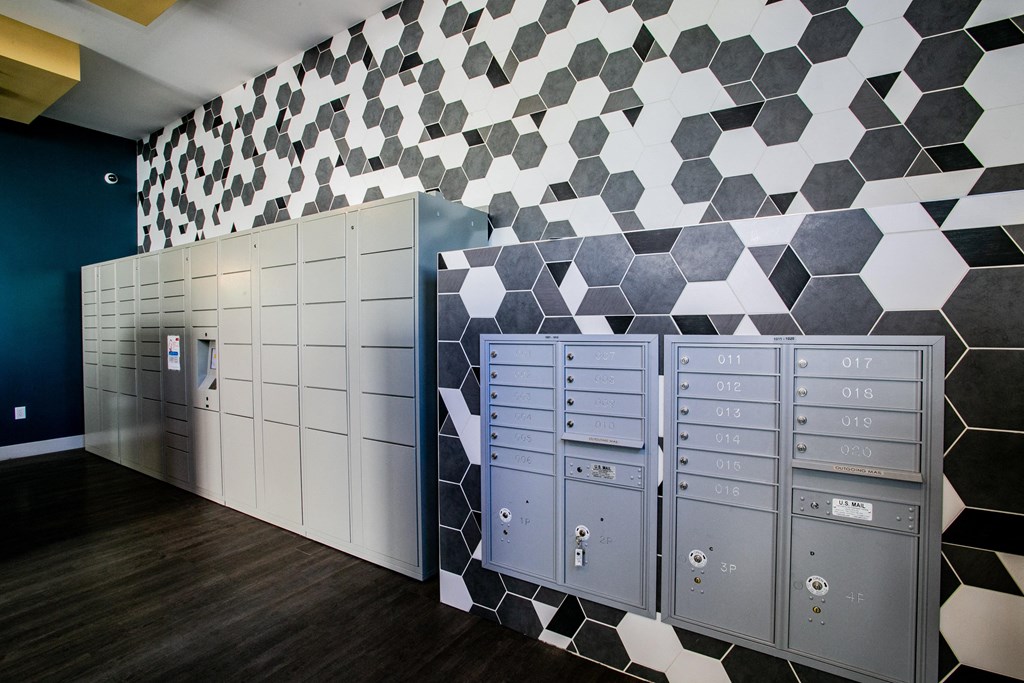a locker room with lockers and a geometric pattern on the wall