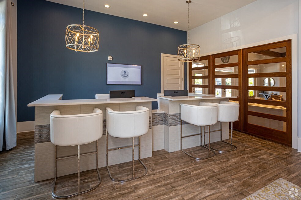a salon with blue walls and white chairs