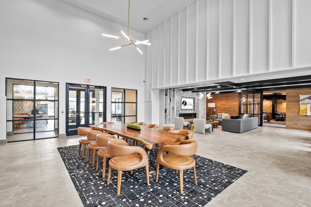 a large conference room with a long wooden table and chairs