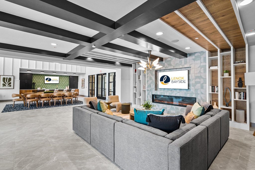 a living room with couches and chairs and a fireplace