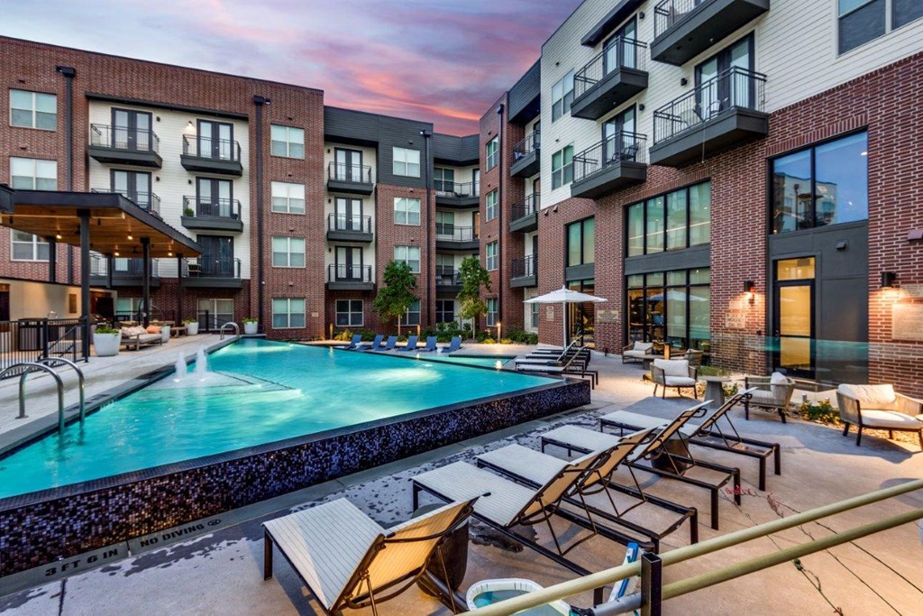 Lenox Cooper Apartments in Arlington, Texas Exterior and Pool with Lounge Chairs