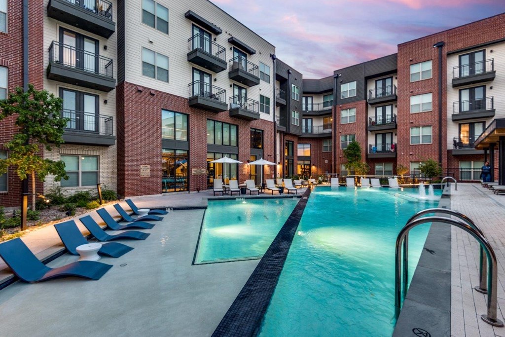 Lenox Cooper Apartments in Arlington, Texas Exterior and Pool with Lounge Chairs