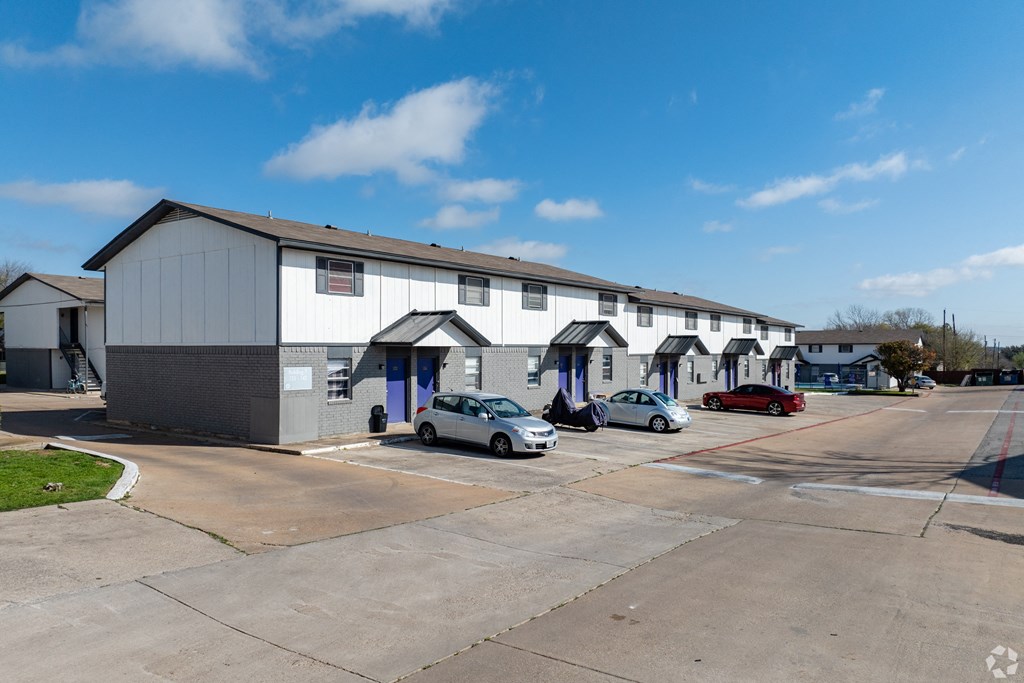 a building with cars parked in front of it
