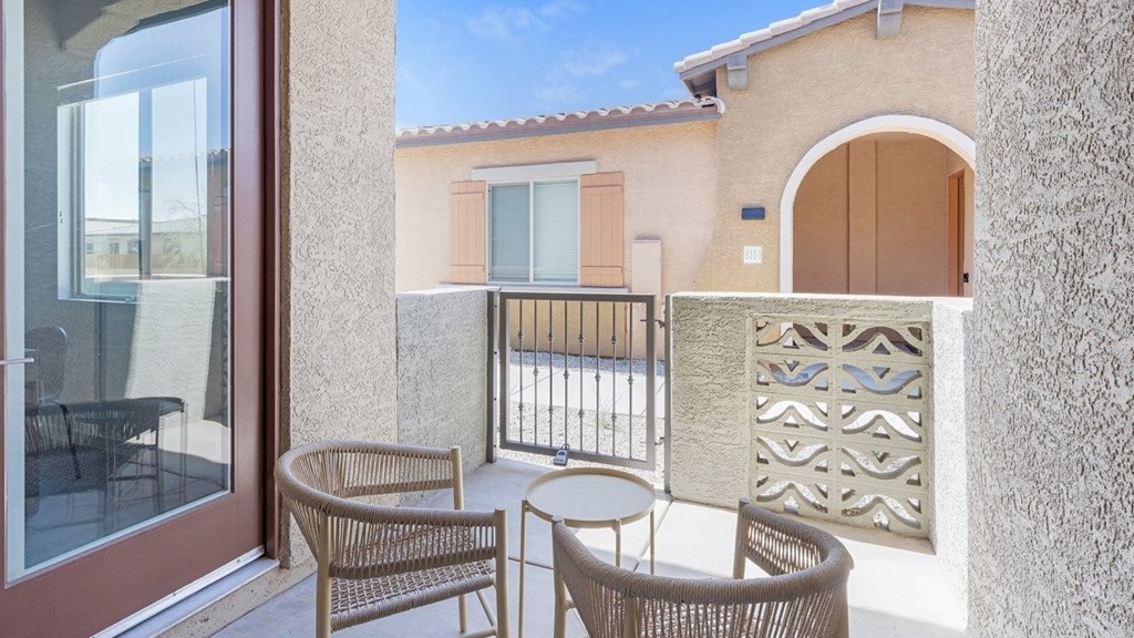 A patio with a table and chairs is shown.