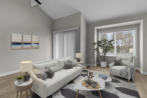 a living room with grey walls and white couches