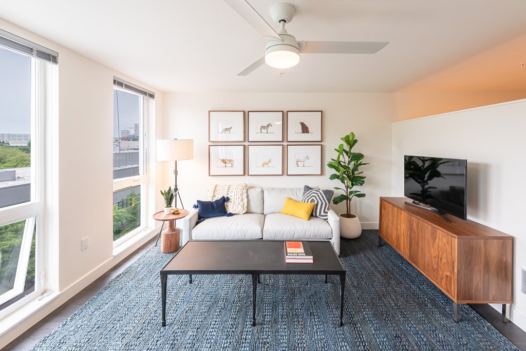 Living Room with Ceiling Fan, Floor to Ceiling Windows