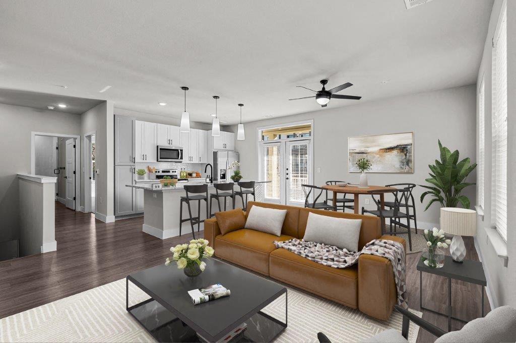 a living room and kitchen with a couch and a table at Lenox Grand, Austin, TX 