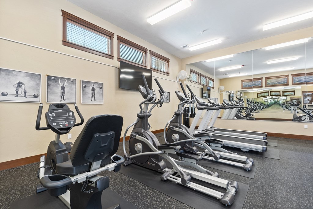 Little Tuscany Apartments & Townhomes - Fitness Room with Treadmills, Elliptical, Stationary Bikes, Mirrors
