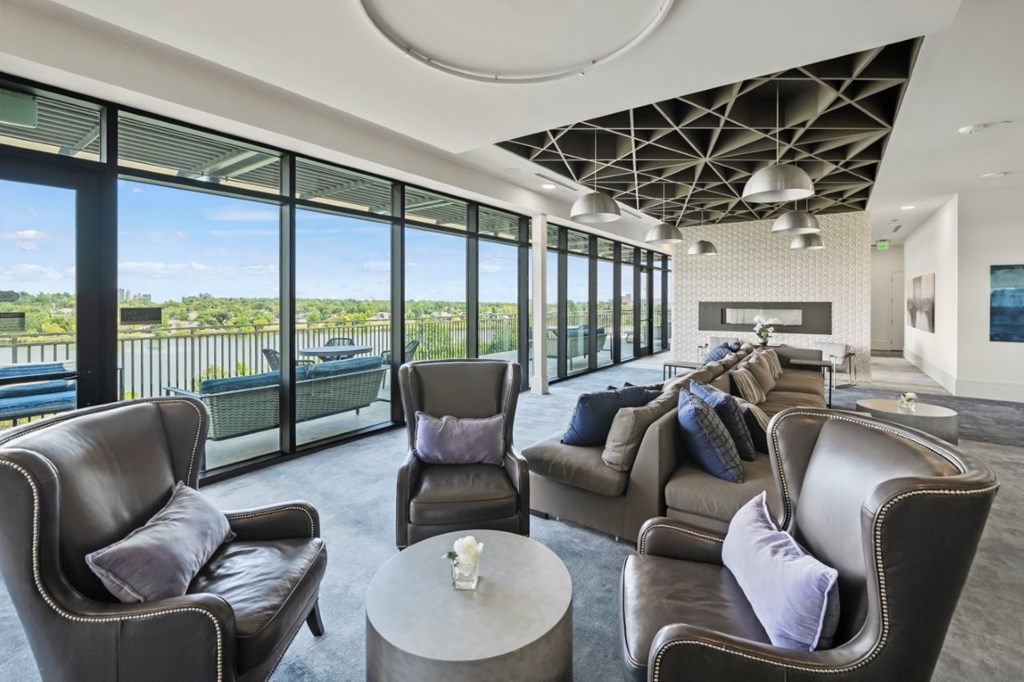 A living room with a large window and a view of the outdoors.
