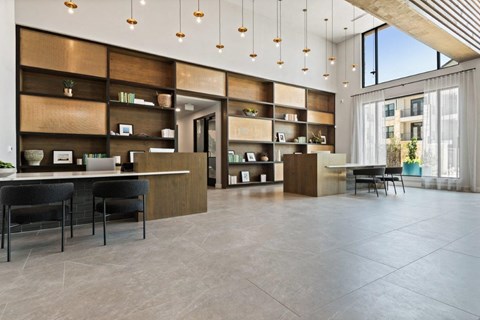 a rendering of a lobby with a desk and chairs