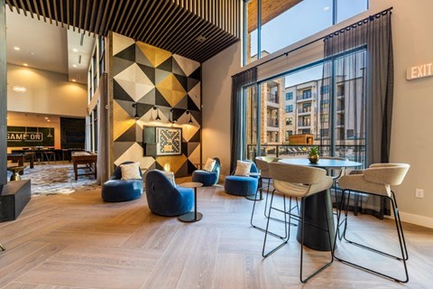 a rendering of the lobby of a hotel with a table and chairs
