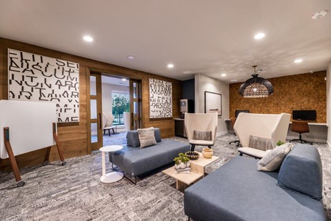 a living room with couches and chairs and a television