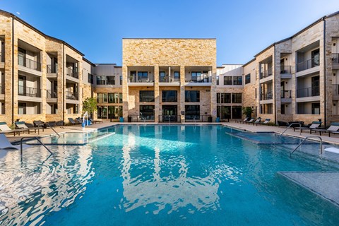 Maddox Hills Exterior and Pool with Lounge Chairs