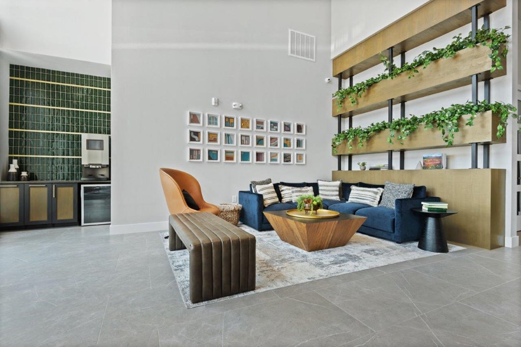 a living room with a blue couch and a coffee table