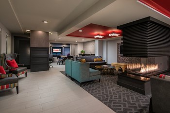 Main Street Flats Apartments Clubhouse Seating and Fireplace Main Street Flats Apartments Clubhouse Seating and Fireplace - Photo Gallery 4