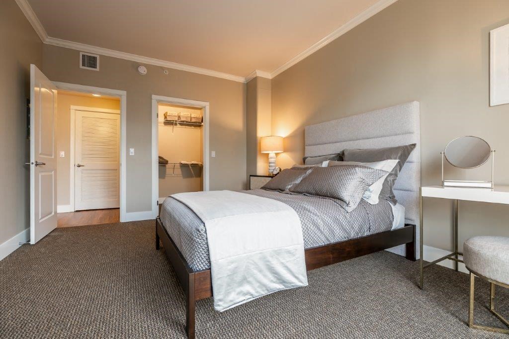 The Mercer bedroom with bed, closet, and desk