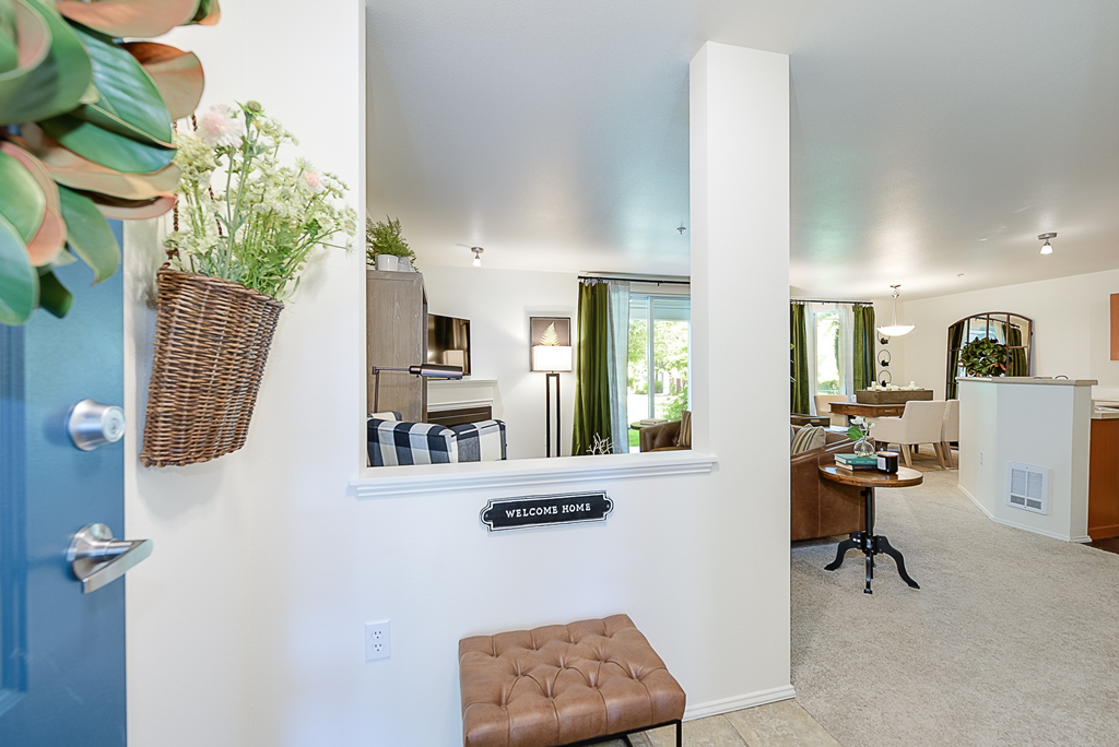 a view of the living room and kitchen from the entryway