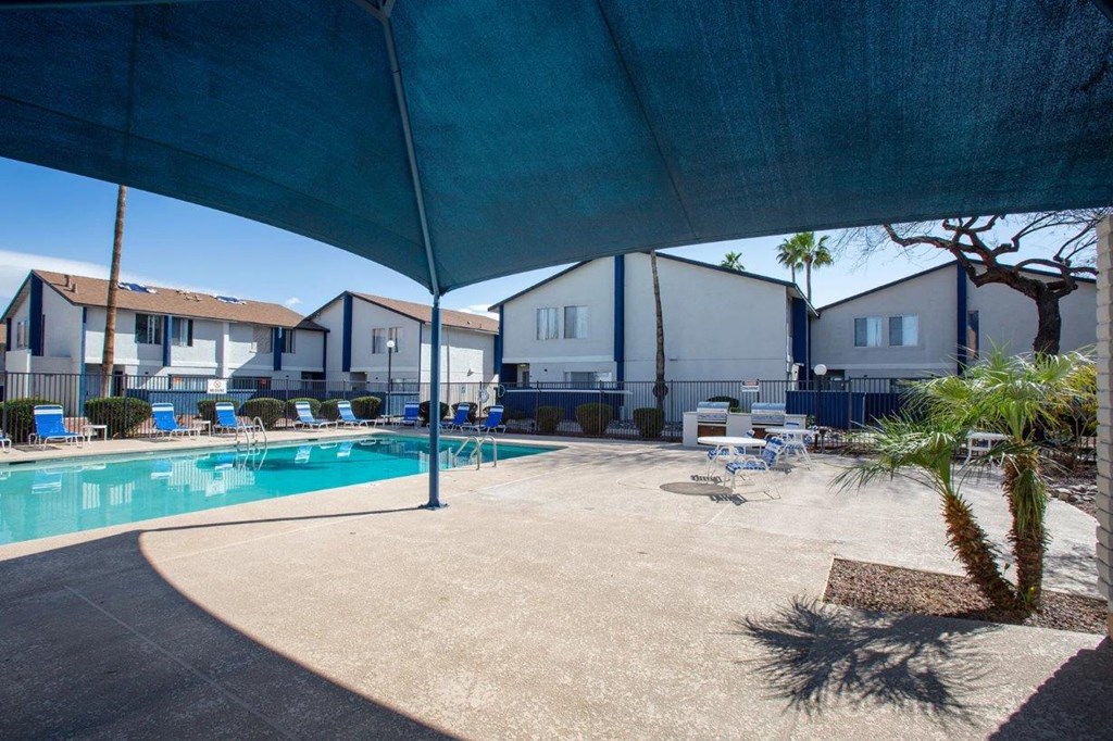 our apartments have a swimming pool with chairs and tables