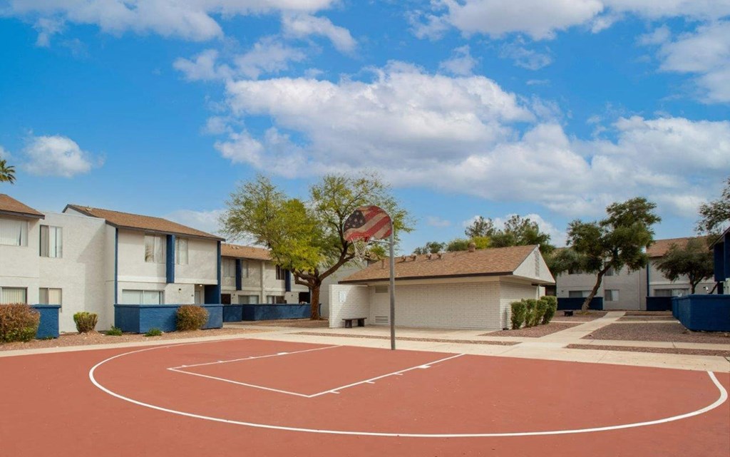 a basketball court in a neighborhood with houses