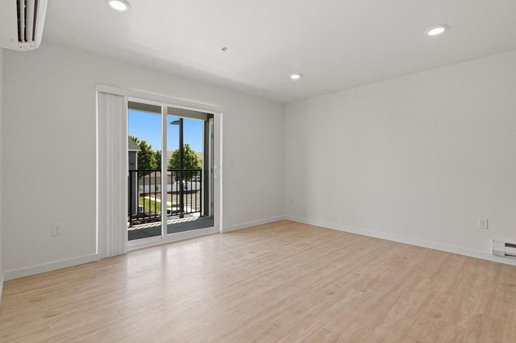 Mill Creek Apartments Living Room with Private Balcony