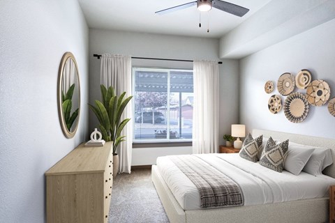 A bedroom with a large bed, a wooden cabinet, and a window with curtains.