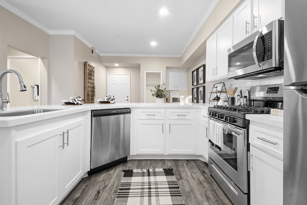 Estancia at Mission Grove Apartments Kitchen with Stainless Steel Appliances Estancia at Mission Grove Apartments Kitchen with Stainless Steel Appliances