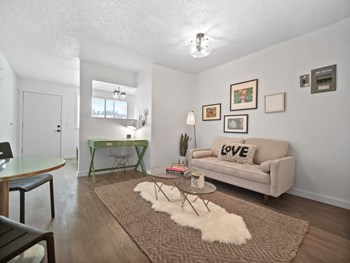 The Imperial Apartments Model Studio Living Room and Desk - Photo Gallery 4