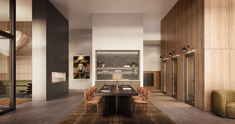 A modern dining room with a long table and chairs.