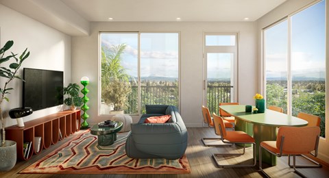 A living room with a grey sofa and a green table.