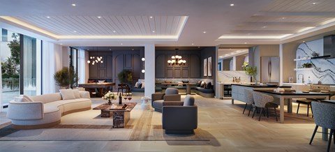 A modern living room with a large white sofa and a dining table with chairs.