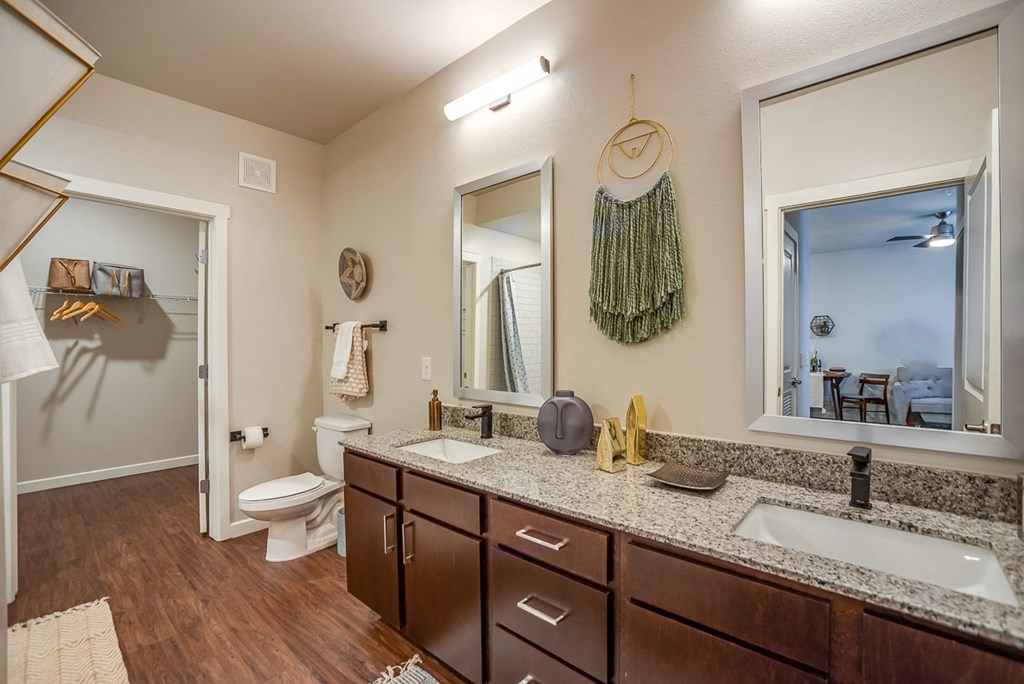 Discovery at the Realm Apartments bathroom with double vanity and double mirrors