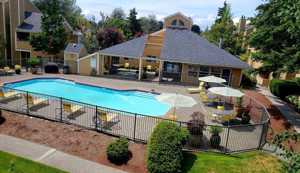 Nickel Creek Apartments in Lynwood, Washington Pool with Lounge Chairs and Covered Seating