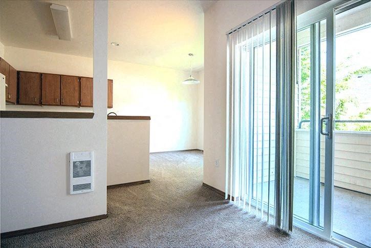 Reedville Commons interior living room and window to patio