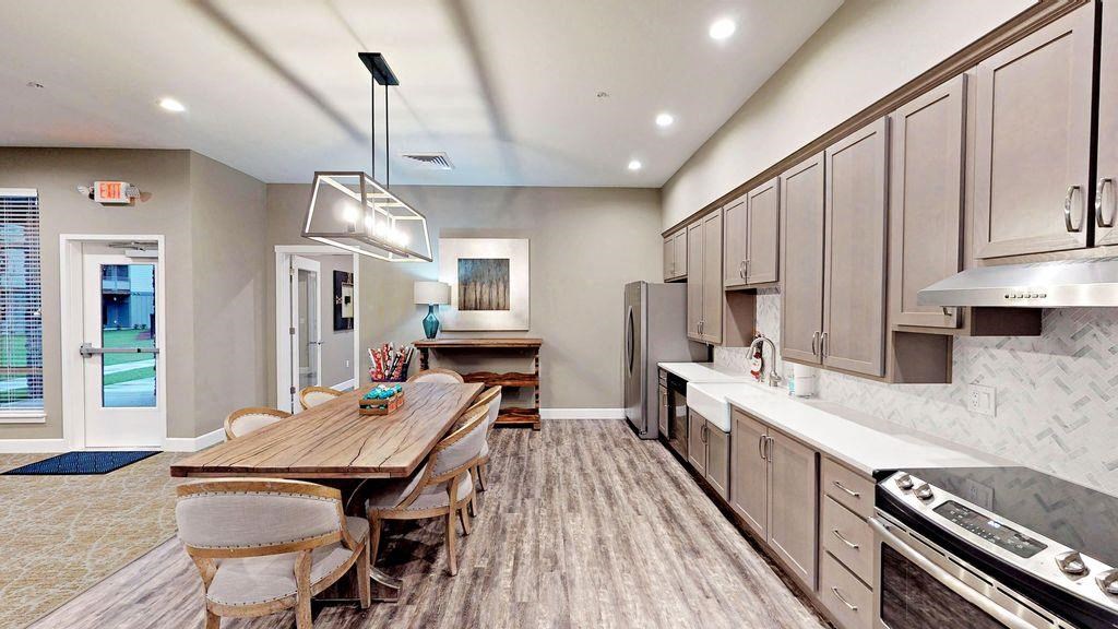 Fruitland Meadow Clubhouse Kitchen with Dining Table Fruitland Meadow Clubhouse Kitchen with Dining Table