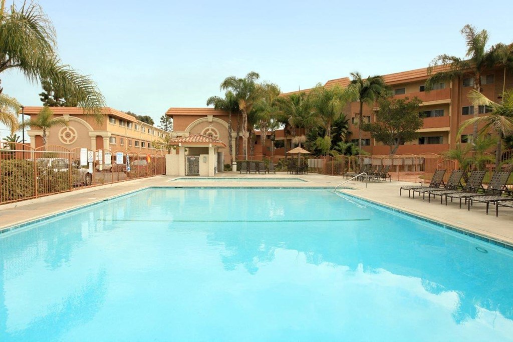 Ocean Breeze Villas Pool with Lounge Chairs