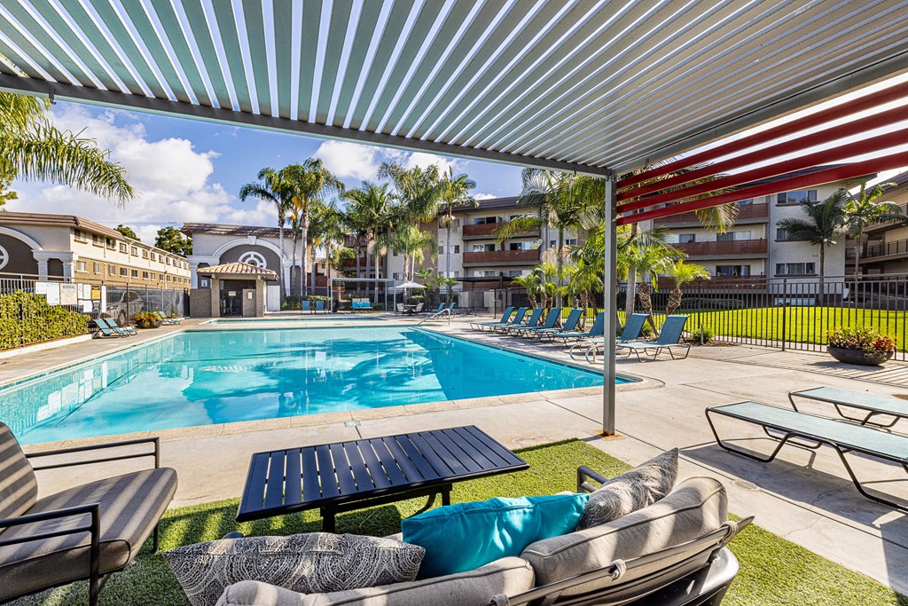 Ocean Breeze Villas Pool with Lounge Chairs