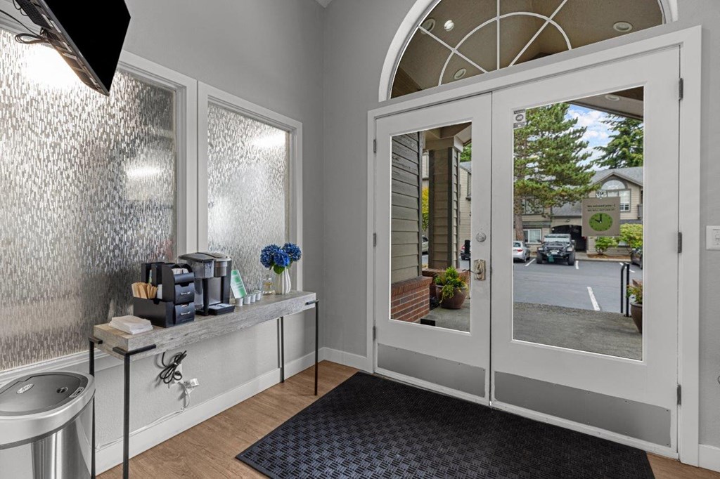 a bathroom with a sink and a glass door