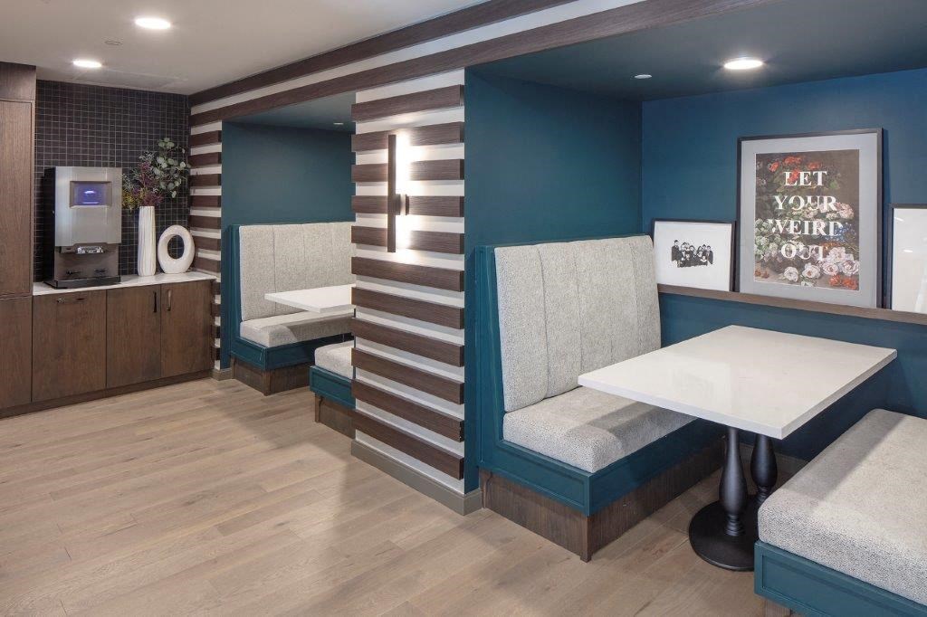 a restaurant with two booths and a table