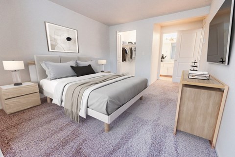 A bedroom with a bed, nightstand, and a carpeted floor.