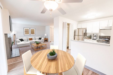 A modern dining room with a wooden table and white chairs.