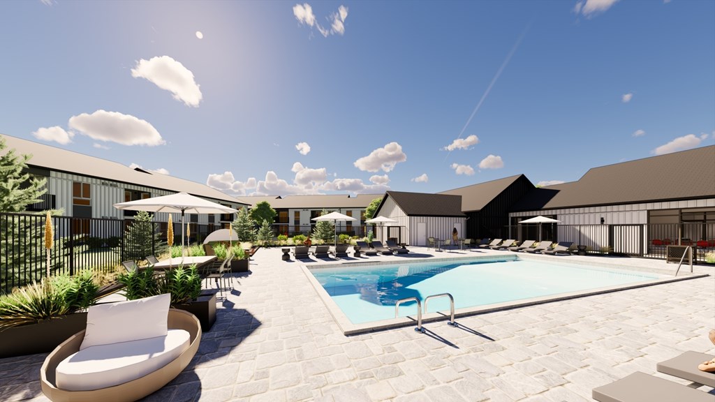 A sunny day at a resort with a pool and lounge chairs.