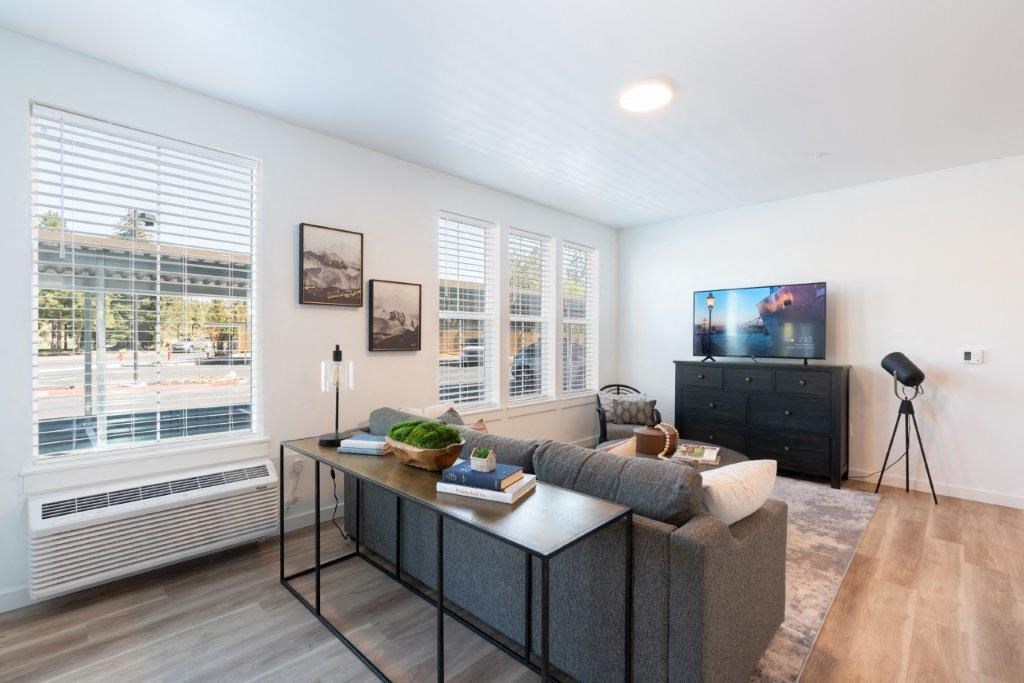 a living room with a couch and a television