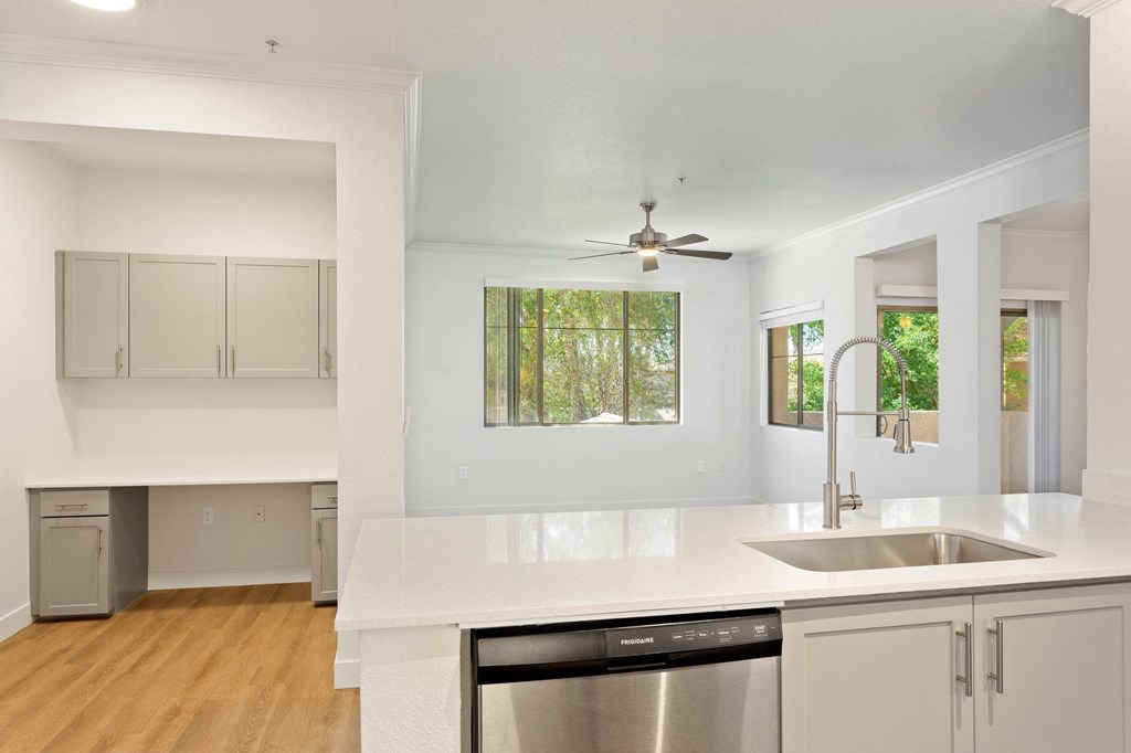 Painted Trails Kitchen and View into Living Room with Built-In Desk