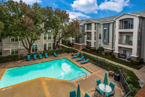 our apartments offer a swimming pool with chairs and umbrellas