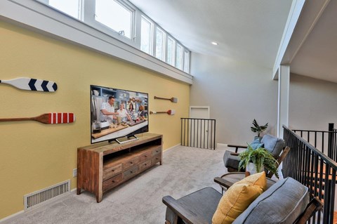 a living room with a couch and a tv